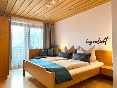 Ein Bett oder Betten in einem Zimmer der Unterkunft Ferienwohnung Anni