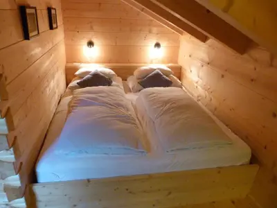 Ein Bett oder Betten in einem Zimmer der Unterkunft Knusperhäusl