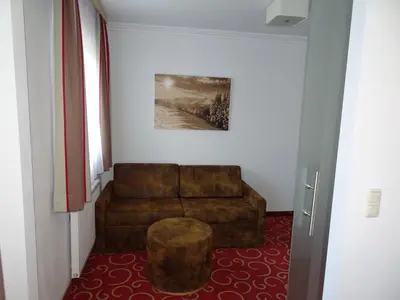 Ein Sitzbereich in der Unterkunft Alpenhotel Landhaus Küchl