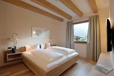 Ein Bett oder Betten in einem Zimmer der Unterkunft Resort Tirol Brixen am Sonnenplateau
