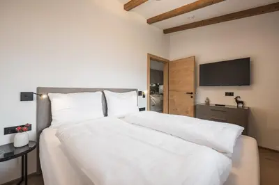 Ein Bett oder Betten in einem Zimmer der Unterkunft Gipfelglueck Comfort LIGHT TOP 4