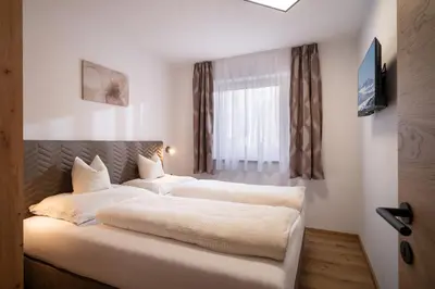 Ein Bett oder Betten in einem Zimmer der Unterkunft Apart Elfi