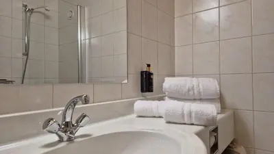 Ein Badezimmer in der Unterkunft Hotel Dahoam by Miha