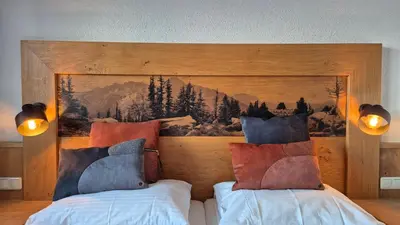 Ein Bett oder Betten in einem Zimmer der Unterkunft Hotel Dahoam by Miha