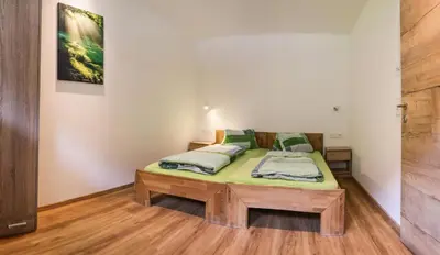 Ein Bett oder Betten in einem Zimmer der Unterkunft Ferienwohnung Brenner
