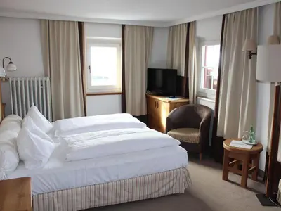 Ein Bett oder Betten in einem Zimmer der Unterkunft Hotel Gasthof Post Nostalgie & Wohlfühlen