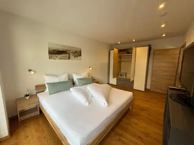 Ein Bett oder Betten in einem Zimmer der Unterkunft Residenz Brixental TOP1
