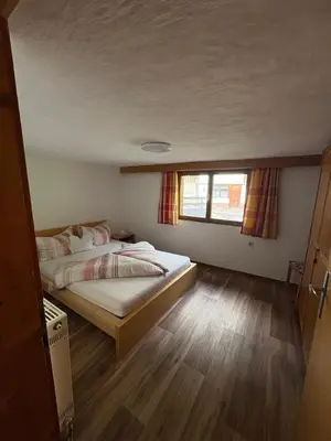 Ein Bett oder Betten in einem Zimmer der Unterkunft Talgenbichl