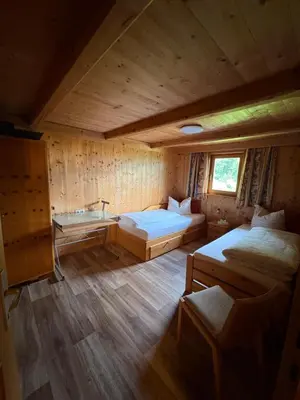 Ein Bett oder Betten in einem Zimmer der Unterkunft Talgenbichl
