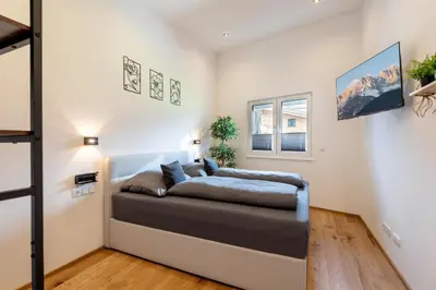 Ein Bett oder Betten in einem Zimmer der Unterkunft Ferienwohnungen N & C