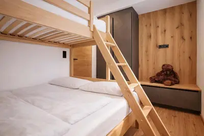 Ein Bett oder Betten in einem Zimmer der Unterkunft BLACKSYTLE - by AlpenLuxus Collection