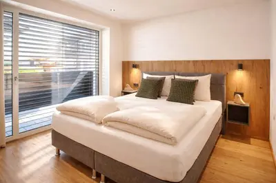 Ein Bett oder Betten in einem Zimmer der Unterkunft BLACKSYTLE - by AlpenLuxus Collection