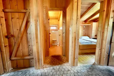 Ein Bett oder Betten in einem Zimmer der Unterkunft NATURAMA Alpenchalet Zillertal