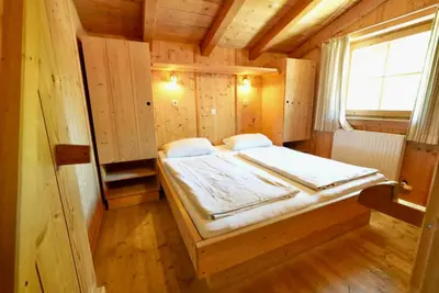 Ein Bett oder Betten in einem Zimmer der Unterkunft NATURAMA Alpenchalet Zillertal