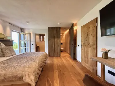 Ein Bett oder Betten in einem Zimmer der Unterkunft DER ERLACHER Alpenrefugium 1874 LUXERY & PRIVACY by Belle-Stay