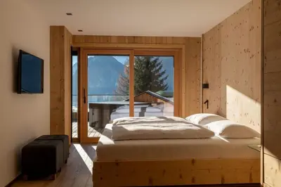Ein Bett oder Betten in einem Zimmer der Unterkunft Chalet Residenz Mühlermoos - Terrassen Chalet