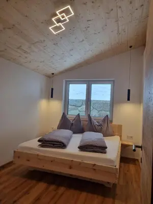 Ein Bett oder Betten in einem Zimmer der Unterkunft Ferienwohnung Kogler Zillertal