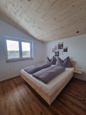 Ein Bett oder Betten in einem Zimmer der Unterkunft Ferienwohnung Kogler Zillertal