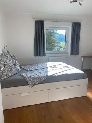 Ein Bett oder Betten in einem Zimmer der Unterkunft Ferienwohnung Lackner
