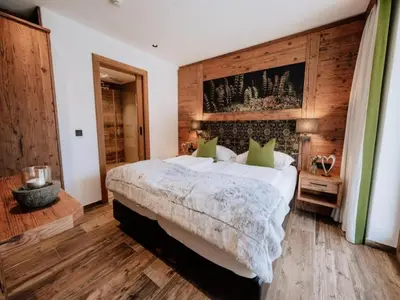 Ein Bett oder Betten in einem Zimmer der Unterkunft Nationalpark Chalet Tulpspitze