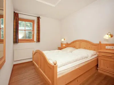 Ein Bett oder Betten in einem Zimmer der Unterkunft Chalet in Königsleiten near Ski Bus & Pool