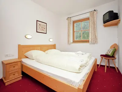 Ein Bett oder Betten in einem Zimmer der Unterkunft Chalet in Königsleiten near Zillertal Ski Area