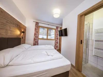 Ein Bett oder Betten in einem Zimmer der Unterkunft Chalet Stay near Krimml Waterfalls