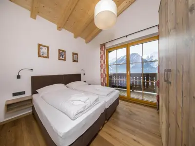 Ein Bett oder Betten in einem Zimmer der Unterkunft Chalet Stay near Krimml Waterfalls