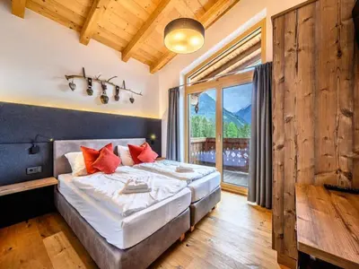 Ein Bett oder Betten in einem Zimmer der Unterkunft Family Chalet Escape in the Alps