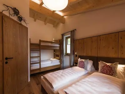 Ein Bett oder Betten in einem Zimmer der Unterkunft Chalet with Sauna and Natural Pool