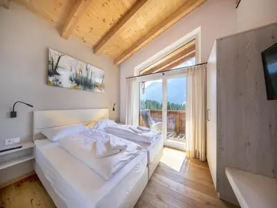 Ein Bett oder Betten in einem Zimmer der Unterkunft Stylish Chalet by Ski Slopes