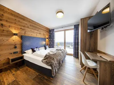 Ein Bett oder Betten in einem Zimmer der Unterkunft Ski-Friendly Chalet in Neukirchen