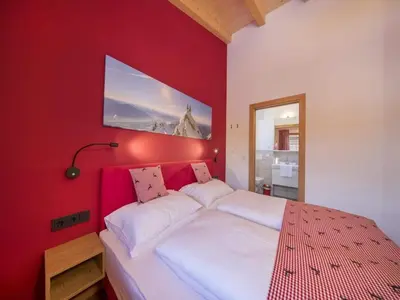 Ein Bett oder Betten in einem Zimmer der Unterkunft Chalet Stay near Krimml Waterfalls