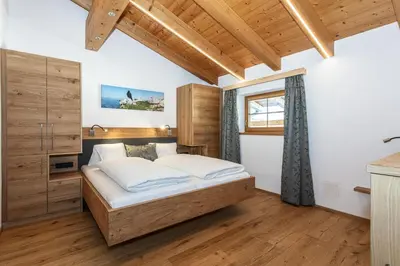 Ein Bett oder Betten in einem Zimmer der Unterkunft Ferienwohnungen Hausbacher-Bichlhof