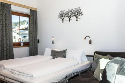 Ein Bett oder Betten in einem Zimmer der Unterkunft Ferienwohnungen Hausbacher-Bichlhof