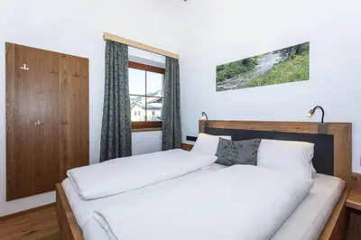 Ein Bett oder Betten in einem Zimmer der Unterkunft Ferienwohnungen Hausbacher-Bichlhof
