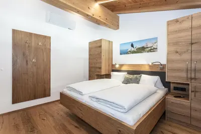 Ein Bett oder Betten in einem Zimmer der Unterkunft Ferienwohnungen Hausbacher-Bichlhof