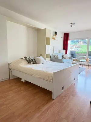Ein Bett oder Betten in einem Zimmer der Unterkunft Alpen Studio Ellmau IV
