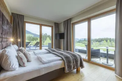 Ein Bett oder Betten in einem Zimmer der Unterkunft Berg & Golf Apartments Westendorf by ALPS RESORTS