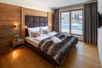 Ein Bett oder Betten in einem Zimmer der Unterkunft Berg & Golf Apartments Westendorf by ALPS RESORTS