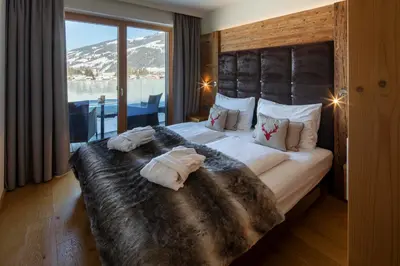 Ein Bett oder Betten in einem Zimmer der Unterkunft Berg & Golf Apartments Westendorf by ALPS RESORTS