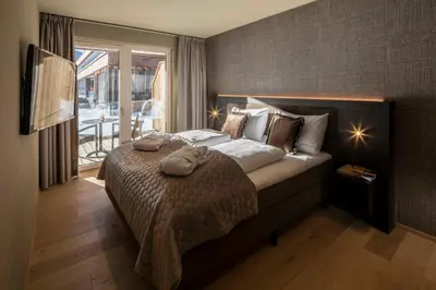 Ein Bett oder Betten in einem Zimmer der Unterkunft Berg & Golf Apartments Westendorf by ALPS RESORTS