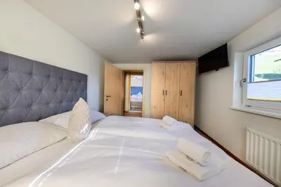Ein Bett oder Betten in einem Zimmer der Unterkunft Mala Family