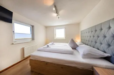 Ein Bett oder Betten in einem Zimmer der Unterkunft Mala Family