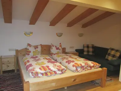 Ein Bett oder Betten in einem Zimmer der Unterkunft Ferienwohnung Sporer