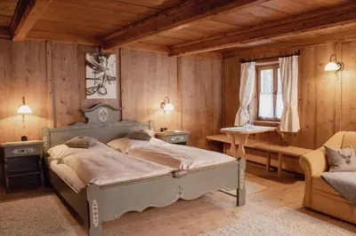 Ein Bett oder Betten in einem Zimmer der Unterkunft Maroslhof