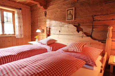 Ein Bett oder Betten in einem Zimmer der Unterkunft Maroslhof