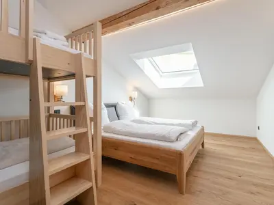 Ein Bett oder Betten in einem Zimmer der Unterkunft Hopfgarten Alpin Living Top 5
