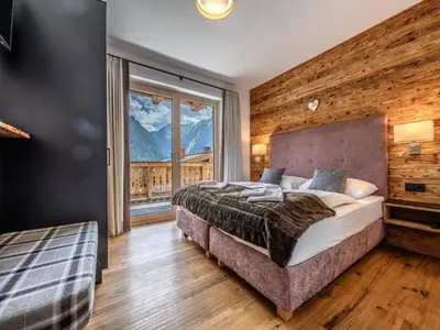 Ein Bett oder Betten in einem Zimmer der Unterkunft Nationalpark Chalet Dreiherrenspitze