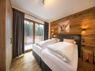 Ein Bett oder Betten in einem Zimmer der Unterkunft Chalet in Neukirchen by the Ski Area